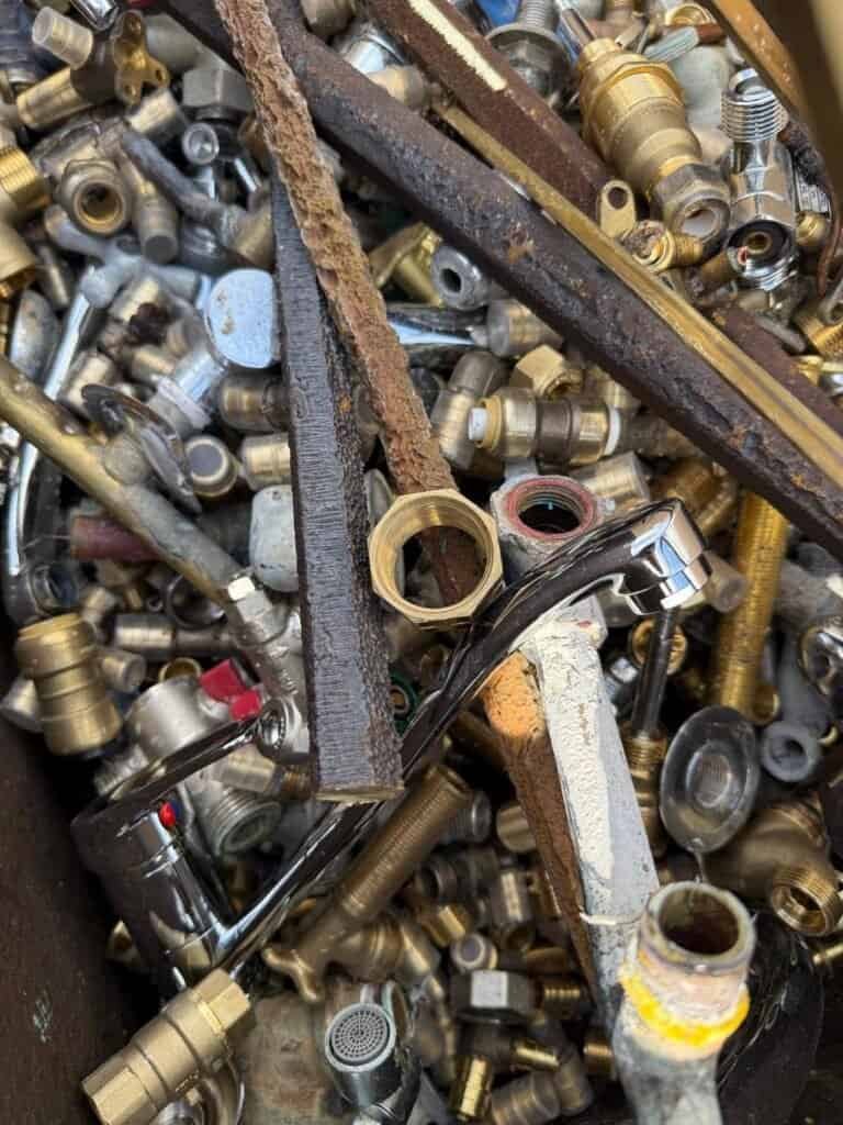 Brass taps, valves and fittings sorted for recycling