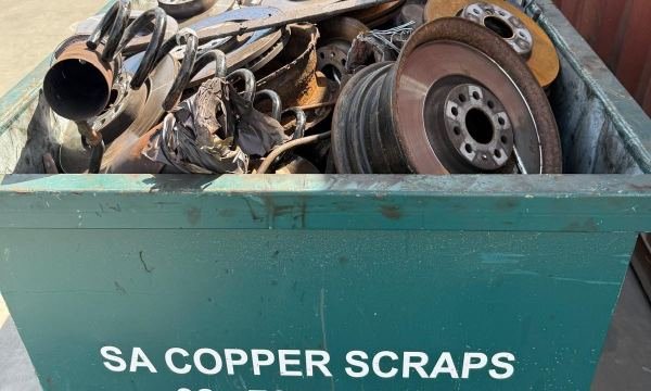 Brake discs and steel scrap in an SA Copper Scraps bin