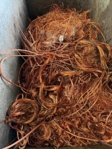 Bare bright copper wire in a sorting bin at the Green Fields yard