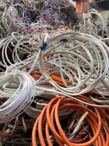 Insulated copper cable waiting to be graded at the yard