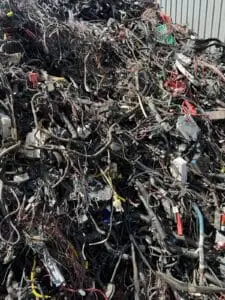Automotive wiring harness and cable scrap awaiting copper recovery