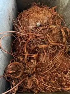 Bare bright copper wire in a bin at the SA Copper Scraps yard