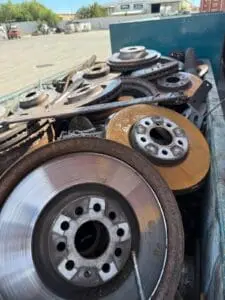 Brake discs and rotors filling a scrap metal bin at Green Fields