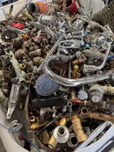 Brass taps, fittings and chrome-plated brass sorted for recycling