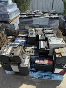 Pallets of used car and truck batteries ready for recycling at SA Copper Scraps