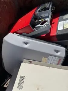 Close-up of a used car battery in a scrap bin at SA Copper Scraps