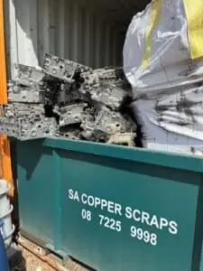 Cast aluminium engine components in an SA Copper Scraps collection bin