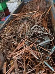 Copper pipe offcuts filling a scrap bin at the Green Fields yard